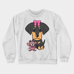 Cute dachshund holds a teddy bear Crewneck Sweatshirt